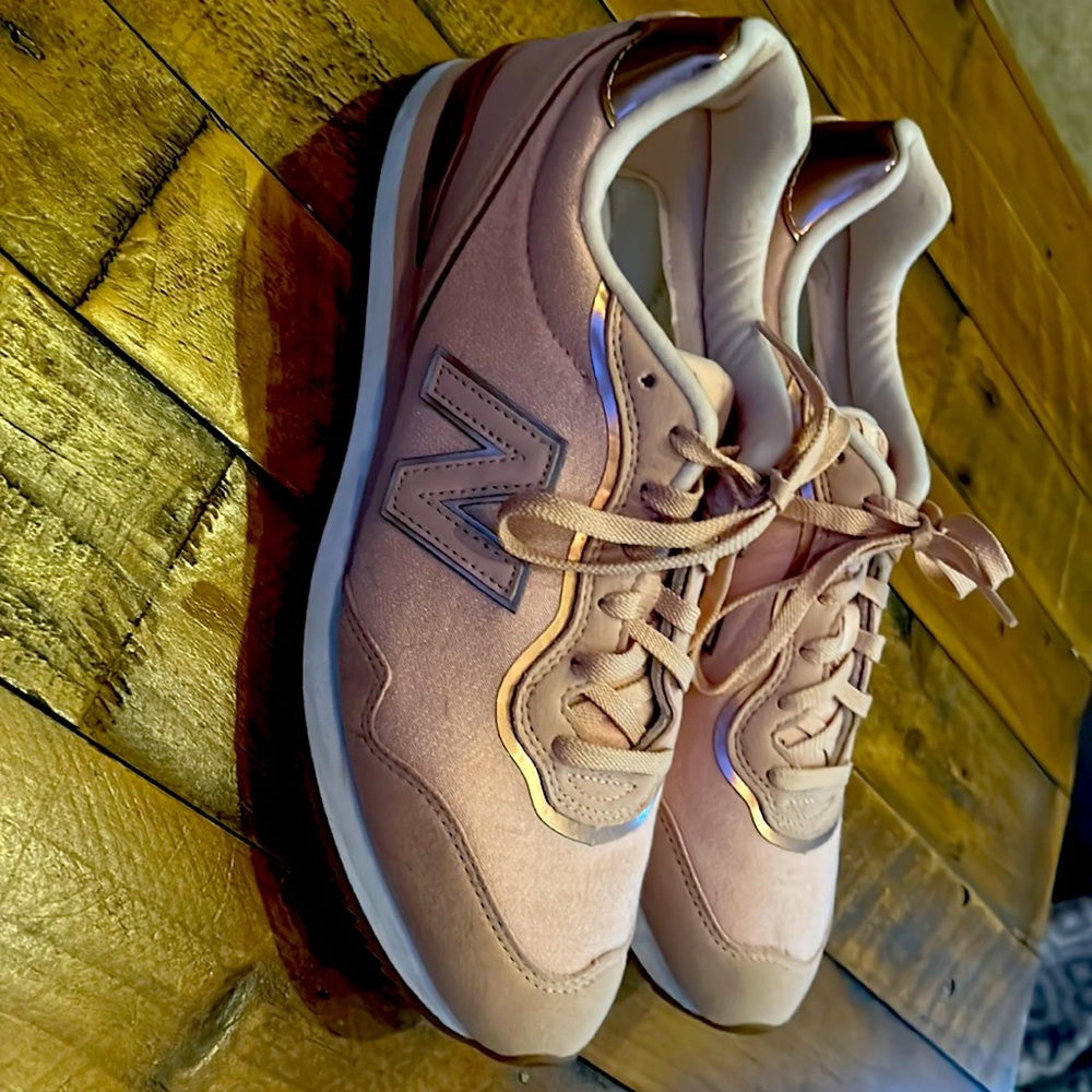 Women’s pink / rose gold new balance sneakers
